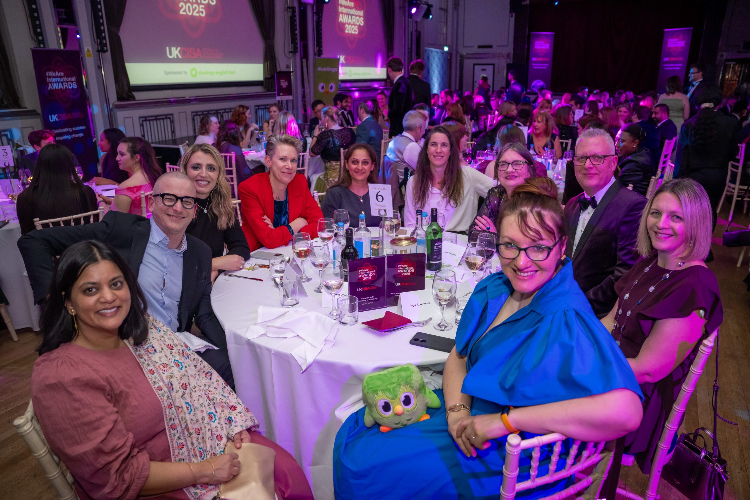 A table of people, including Emma Marku, at the awards ceremony